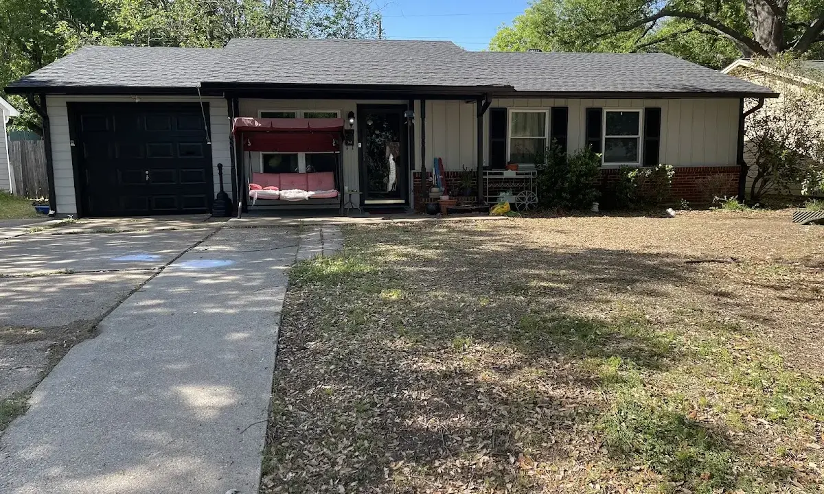 Asphalt Shingle Roof Repair crew at work on a residential roof in Gautier